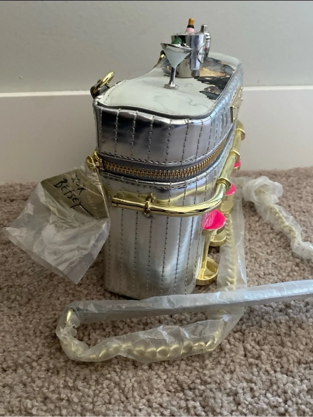Betsey Johnson Silver Cocktail Bar Crossbody with Pink Seat Accents